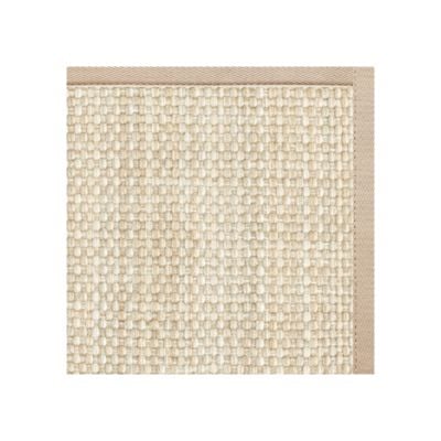Close-up of a woven beige rug with a fabric border along the edges, styled as a stair runner and placed against a white background.