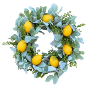 This spring wreath features lemons intertwined with eucalyptus leaves.