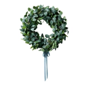 A spring wreath made of eucalyptus on a white background.