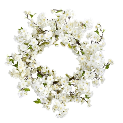 A white cherry blossom wreath on a white background is the perfect addition to brighten up your space during spring.