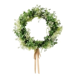 A spring wreath with greenery and ribbon on a white background.