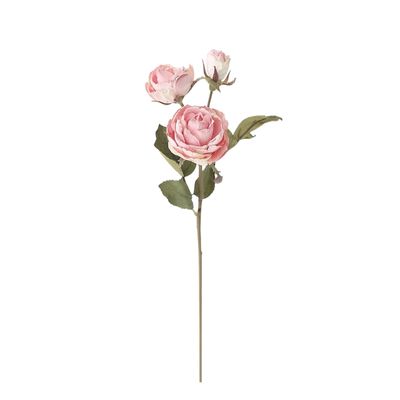 a pink faux flower against a white background.