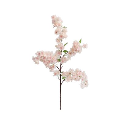A faux flower cherry branch on a white background.