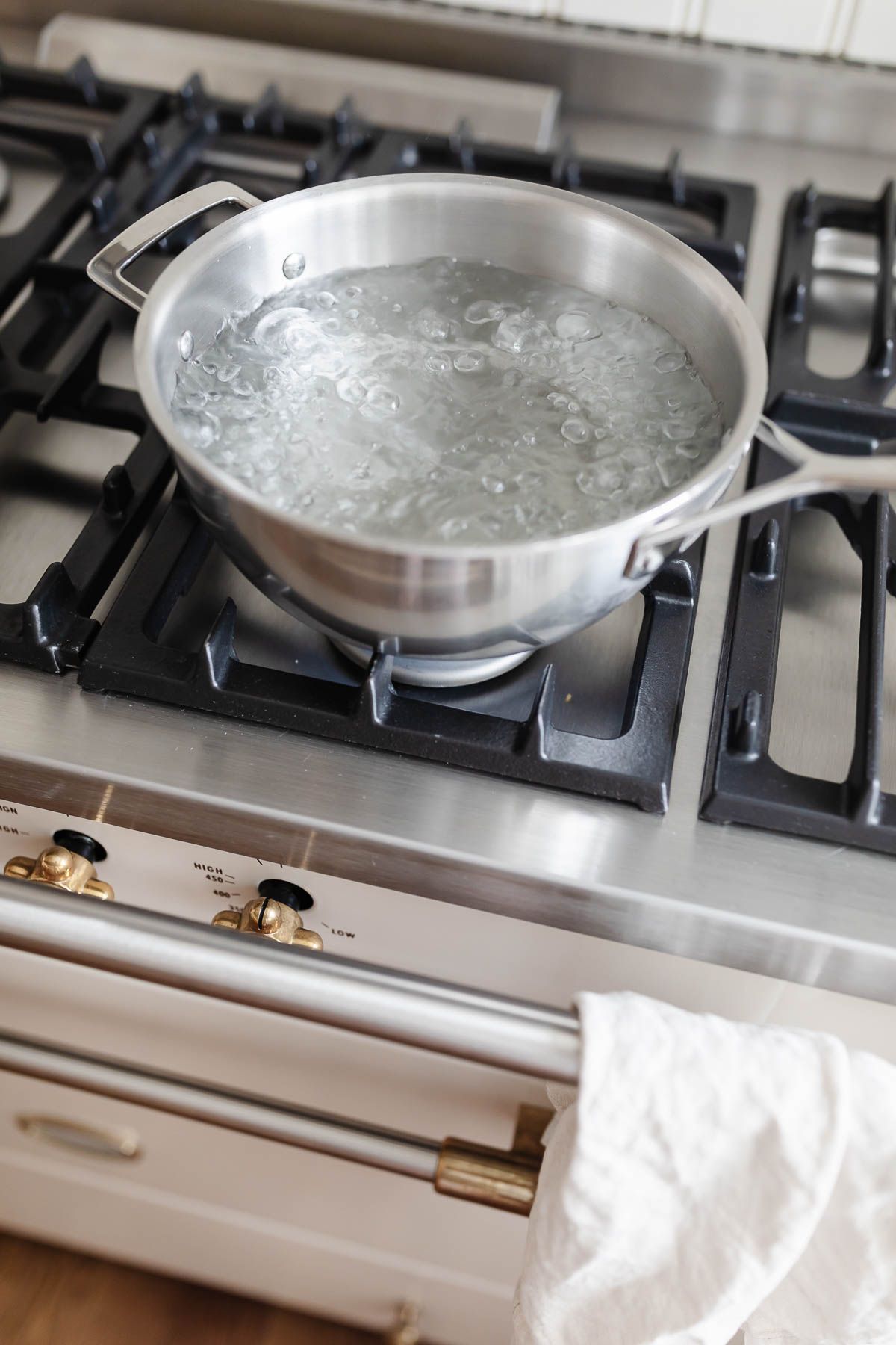 A pot of boiling water on the stove