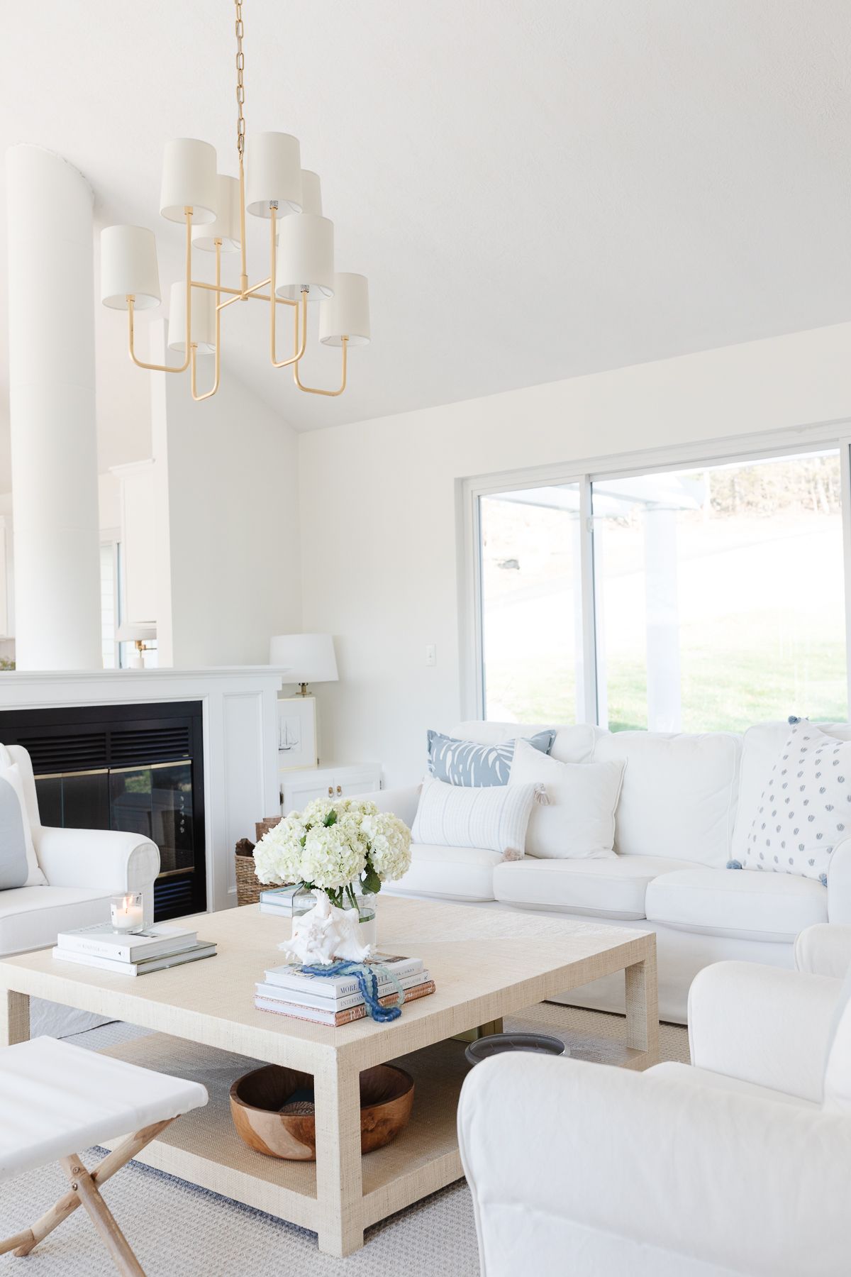 A white living room with the perfect cream living room paint color on the walls