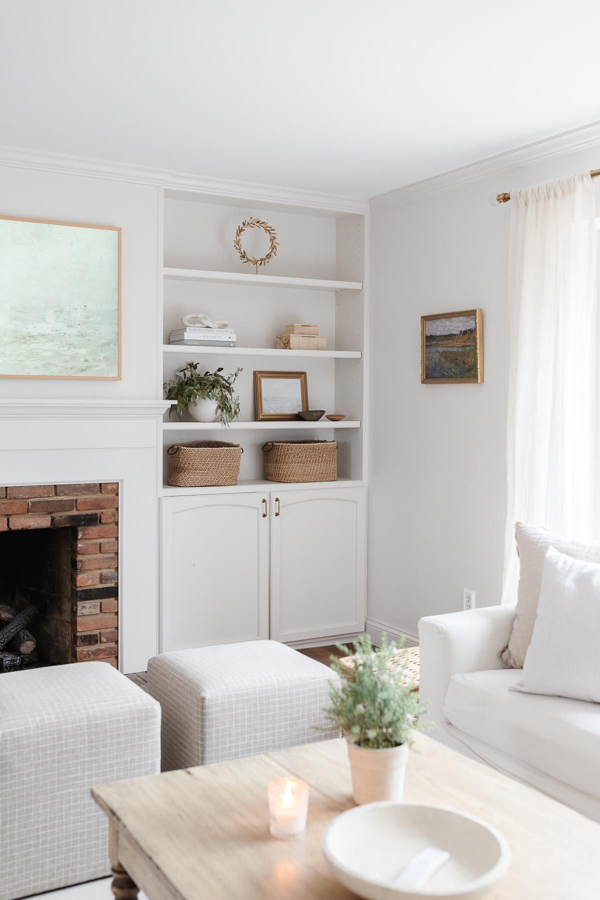 A neutral living room paint color on the walls of a soft neutral living room