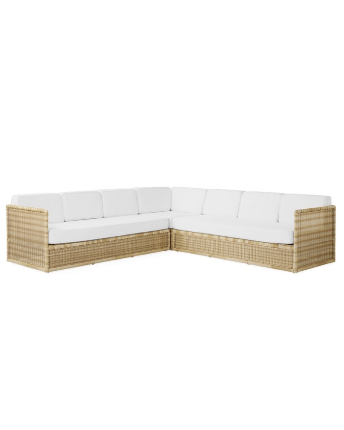 a white and wicker sectional