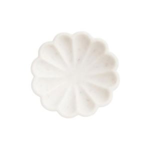 White, round soap bar with a scalloped, flower-like design, viewed from above on a white background—perfect for adding an elegant touch to your nightstand decorating.