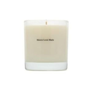 A white candle in a clear glass container labeled "Maison Louis Marie" on the front, perfect for nightstand decorating, against a plain white background.