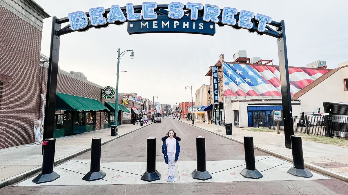 Beale Street entrance with a little girl underneath in a summary of things to do in Memphis with kids