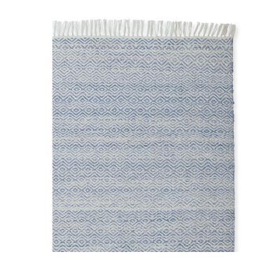 A blue indoor outdoor rug on a white background.