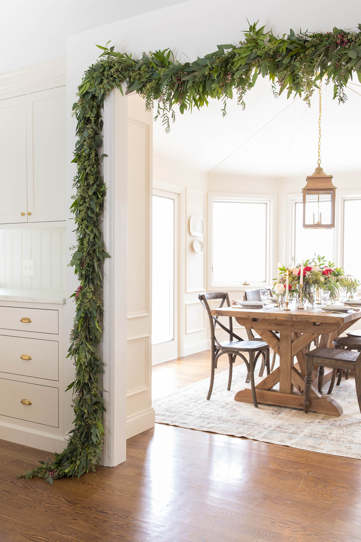 christmas garland framing breakfast room 