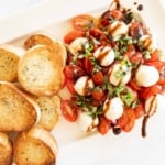 Bruschetta Mozzarella on a white platter