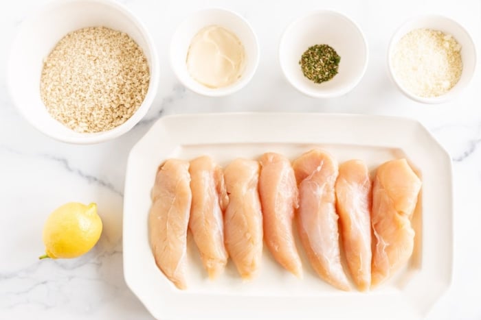 Ingredients for panko chicken, laid out on a marble surface