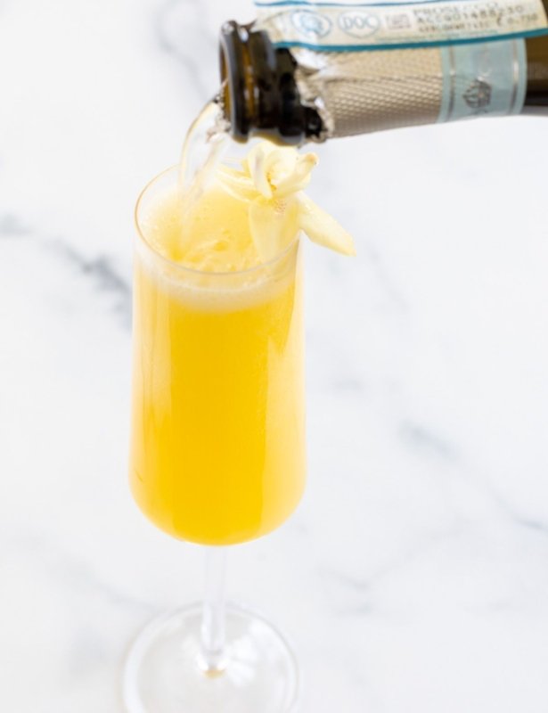 The best prosecco for mimosas pouring into a champagne glass
