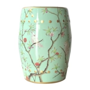 A ceramic garden stool decorated with birds and flowers.