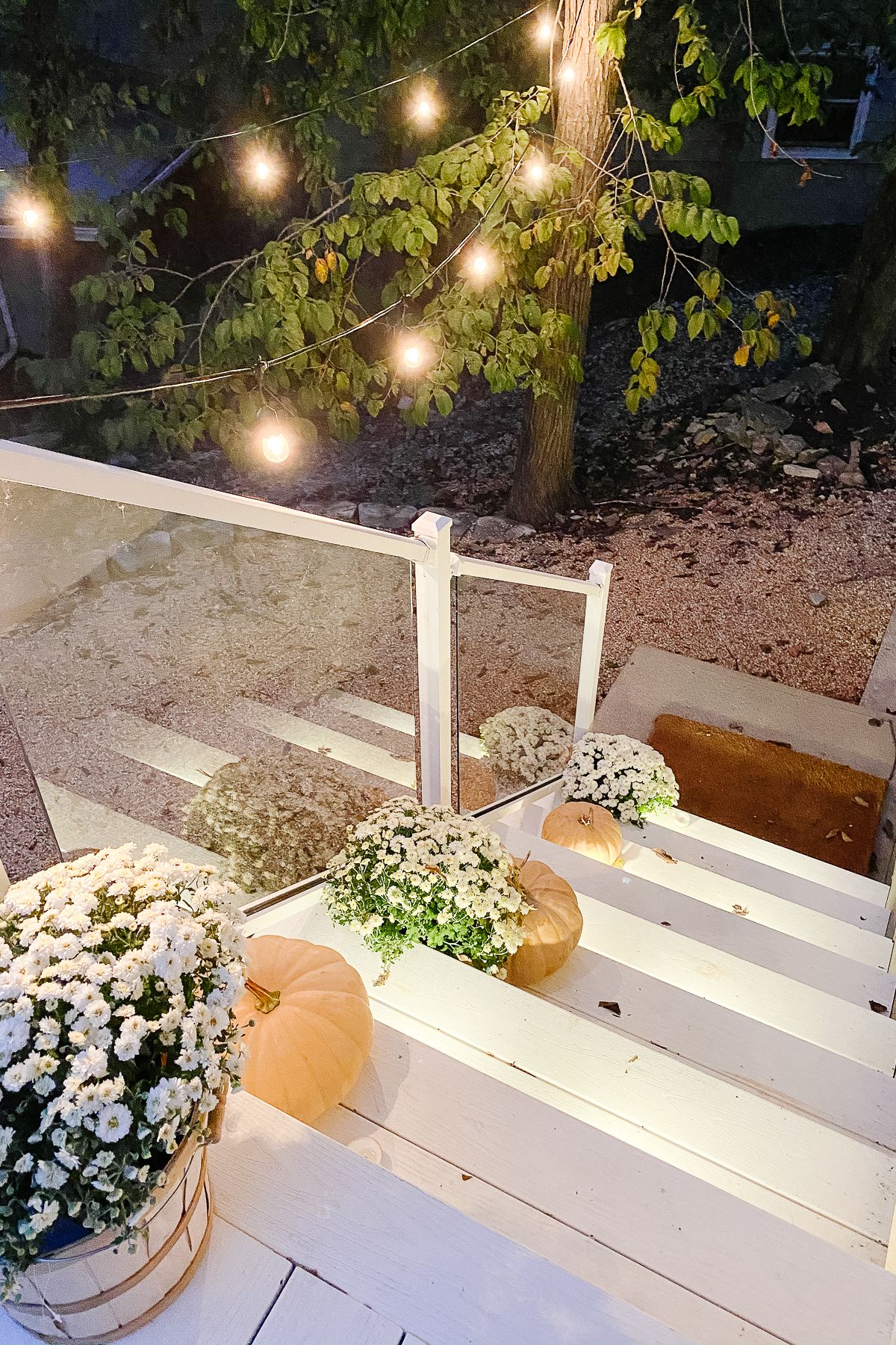 Deck lighting on white vinyl deck steps 