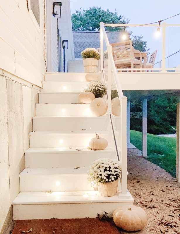 Deck lighting on white vinyl deck steps