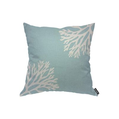 a blue and white pillow with a nautical coral design
