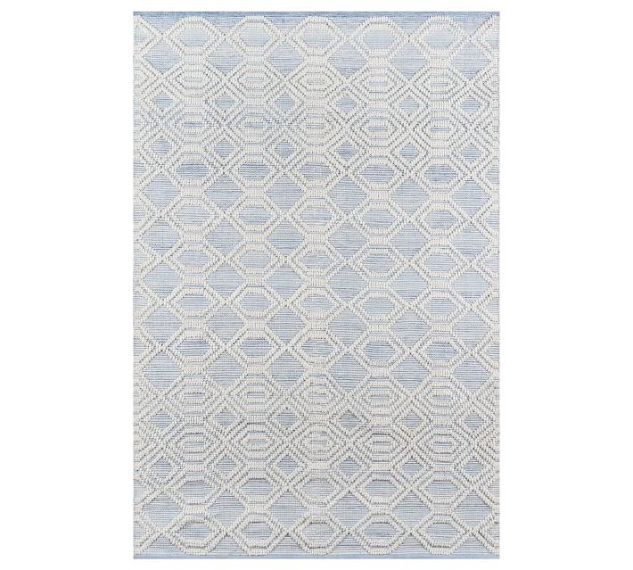 a blue patterned outdoor rug from Pottery Barn