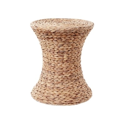 a rattan side table in a guide to Pottery Barn dupes
