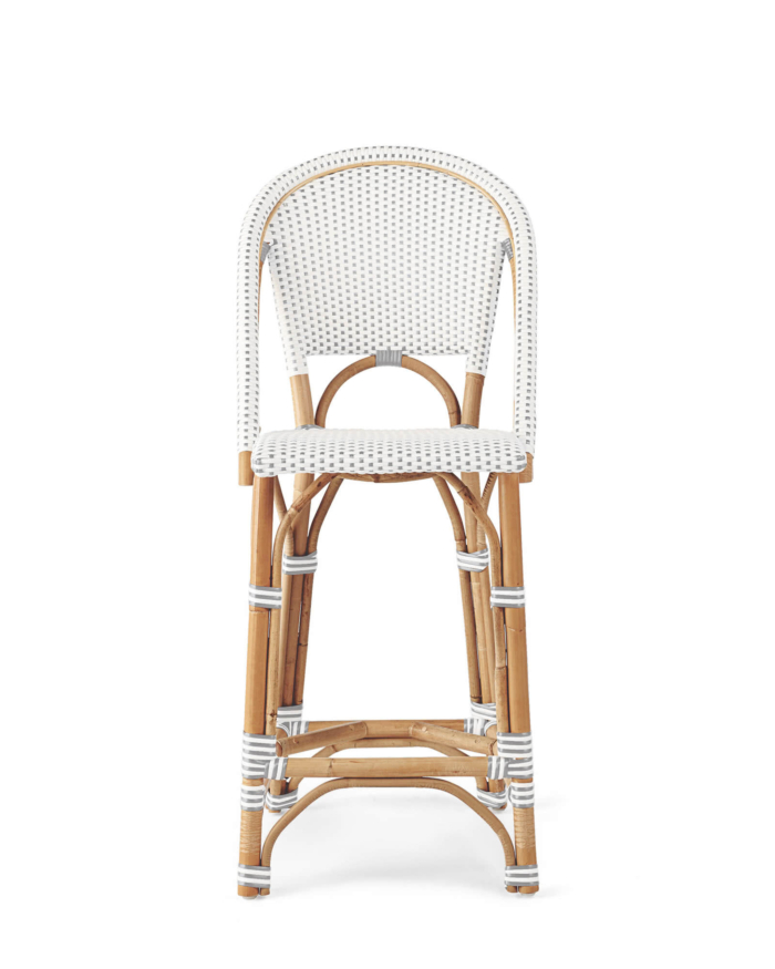 A rattan counter stool against a white background