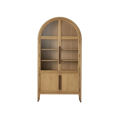 A tall, wooden cabinet with an arched top, perfect for achieving that Arhaus look for less. It features four shelves in the upper section and two closed compartments at the bottom.