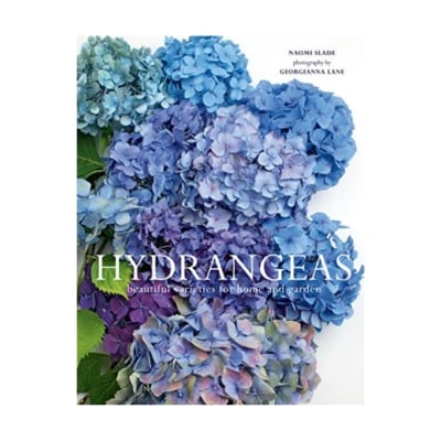 a decorative book with blue hydrangea on the cover
