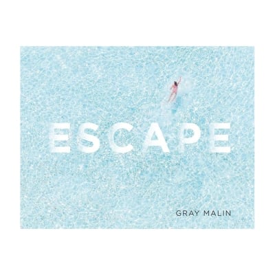 a blue coffee table book called "Escape" by Gray Malin