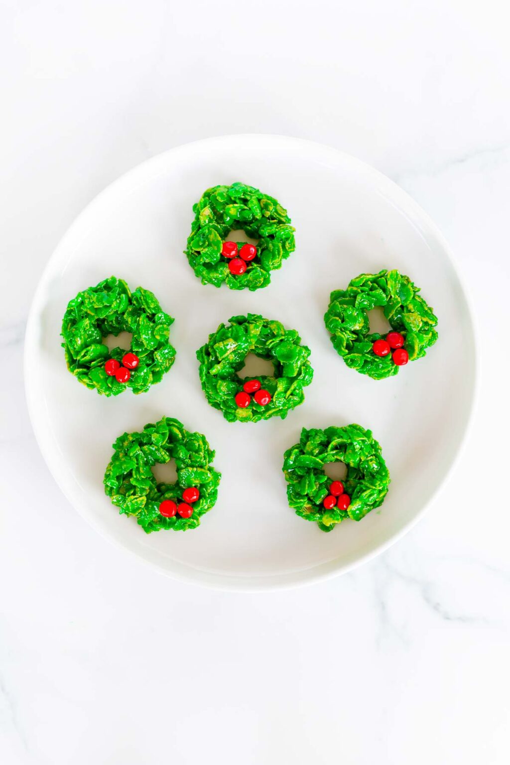 Green wreath no bake cookies on a white plate