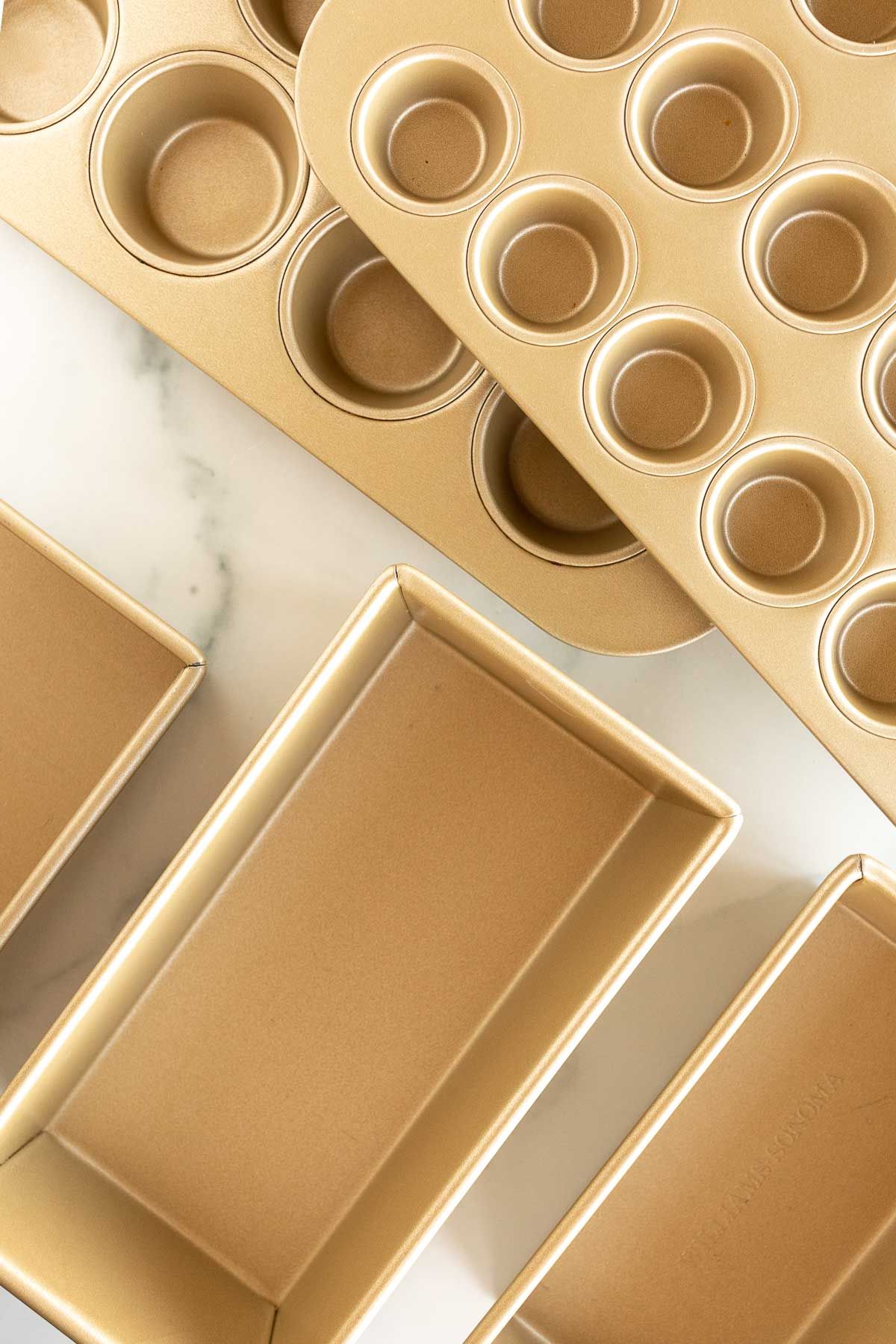 Gold bakeware on a marble surface