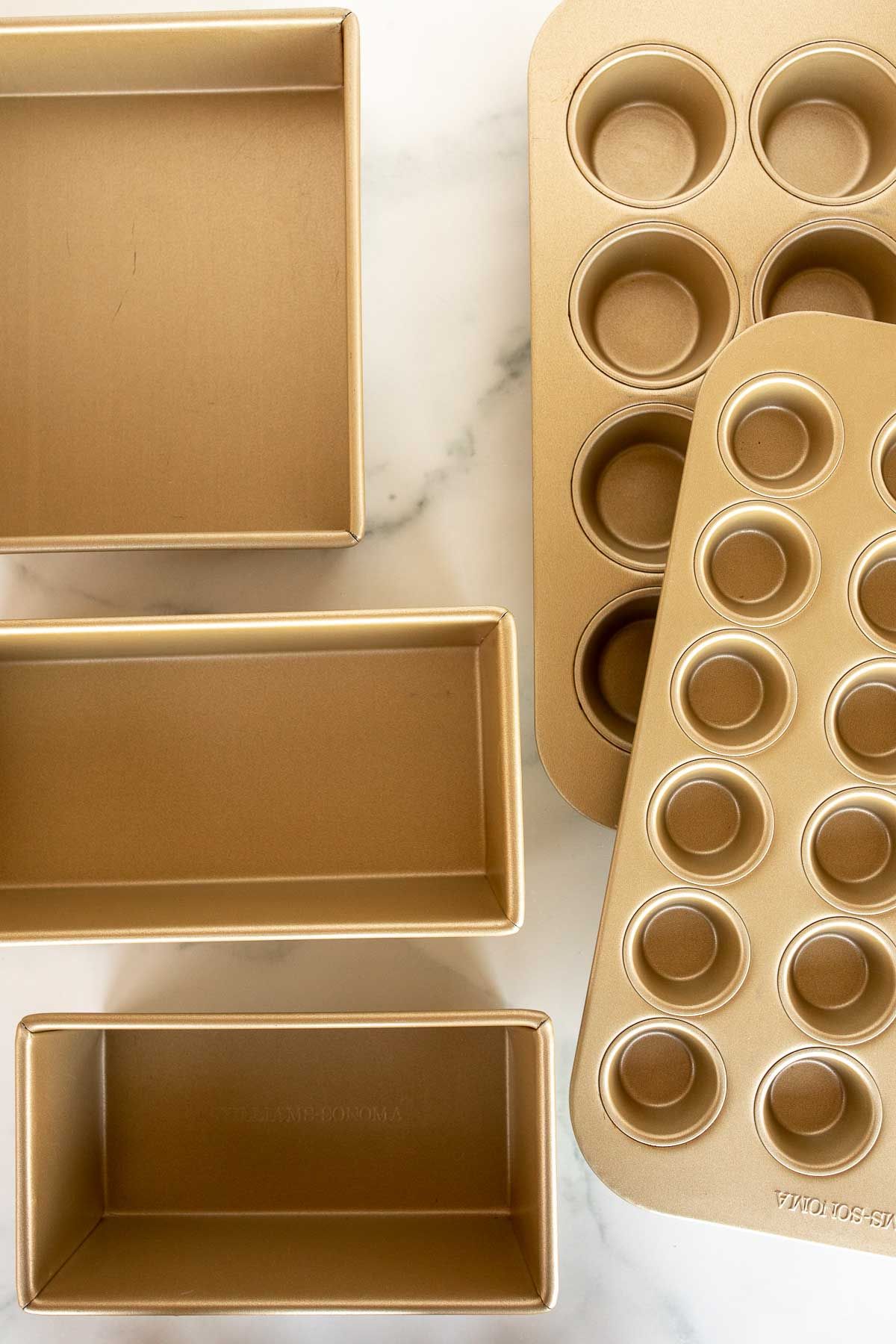 Gold bakeware on a marble surface