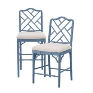 A pair of blue Rattan bar stools.