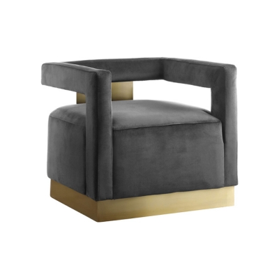 a brass and gray velvet modern armchair