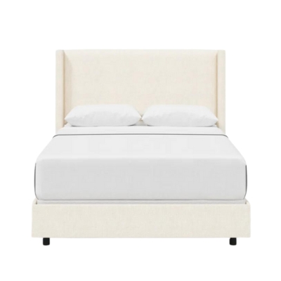 An elegant upholstered bed with a white headboard.