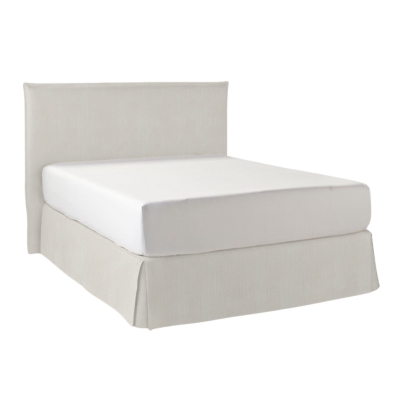 An upholstered bed with a white headboard and footboard.