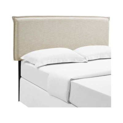 A upholstered bed with white sheets.