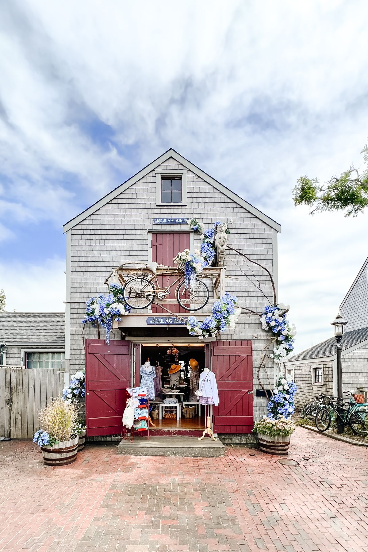 A storefront with open doors, and hydrangeas crawling up the front, in a guide to Things to do on Nantucket