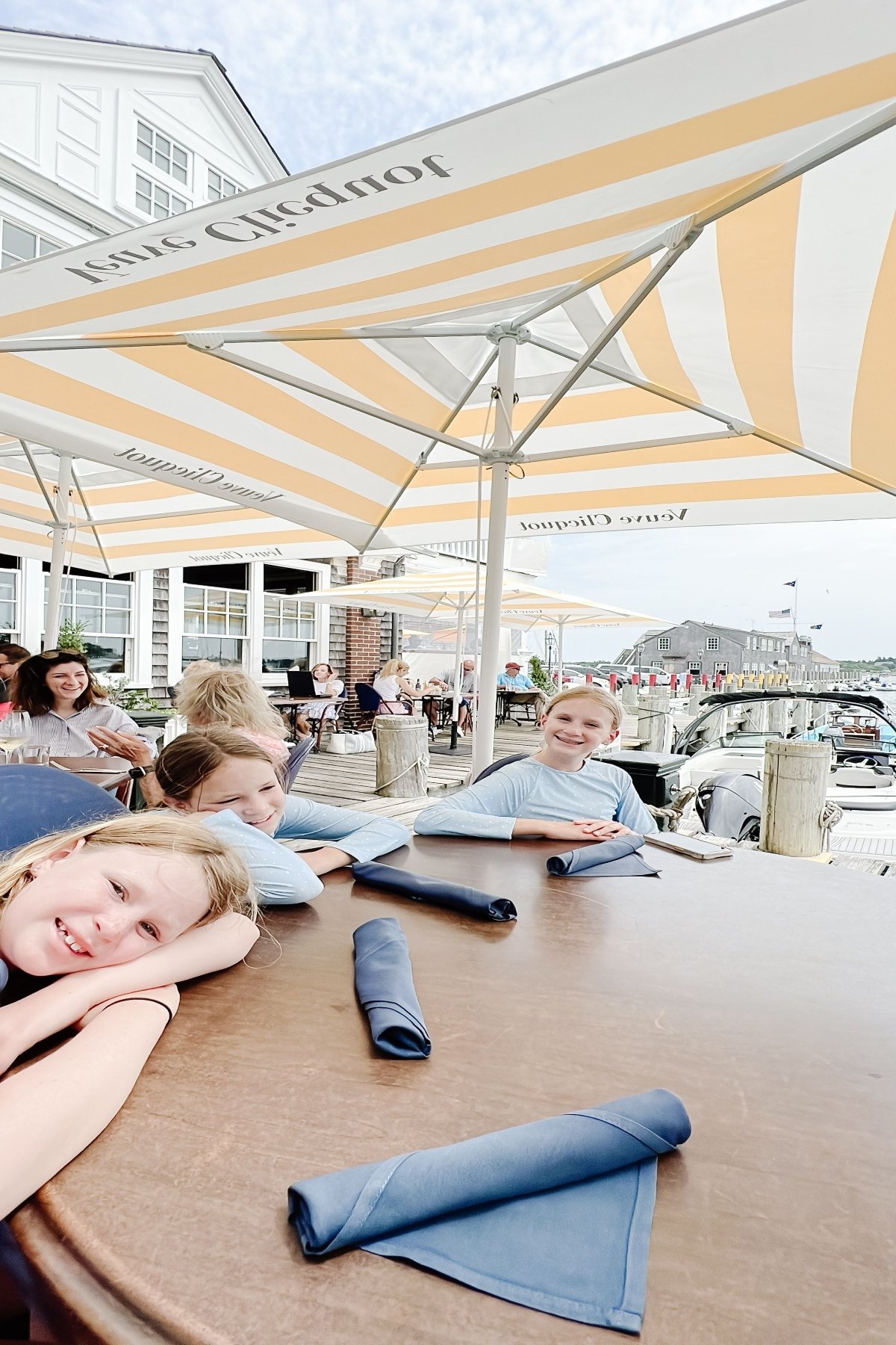 Three little girls sitting at an outdoor patio table at a restaurant on Martha's Vineyard