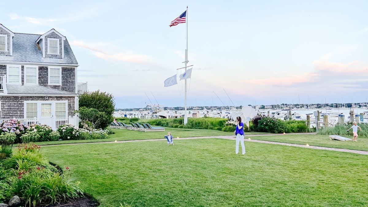 A green lawn in front of a harbor in a guide for Things to do in Nantucket