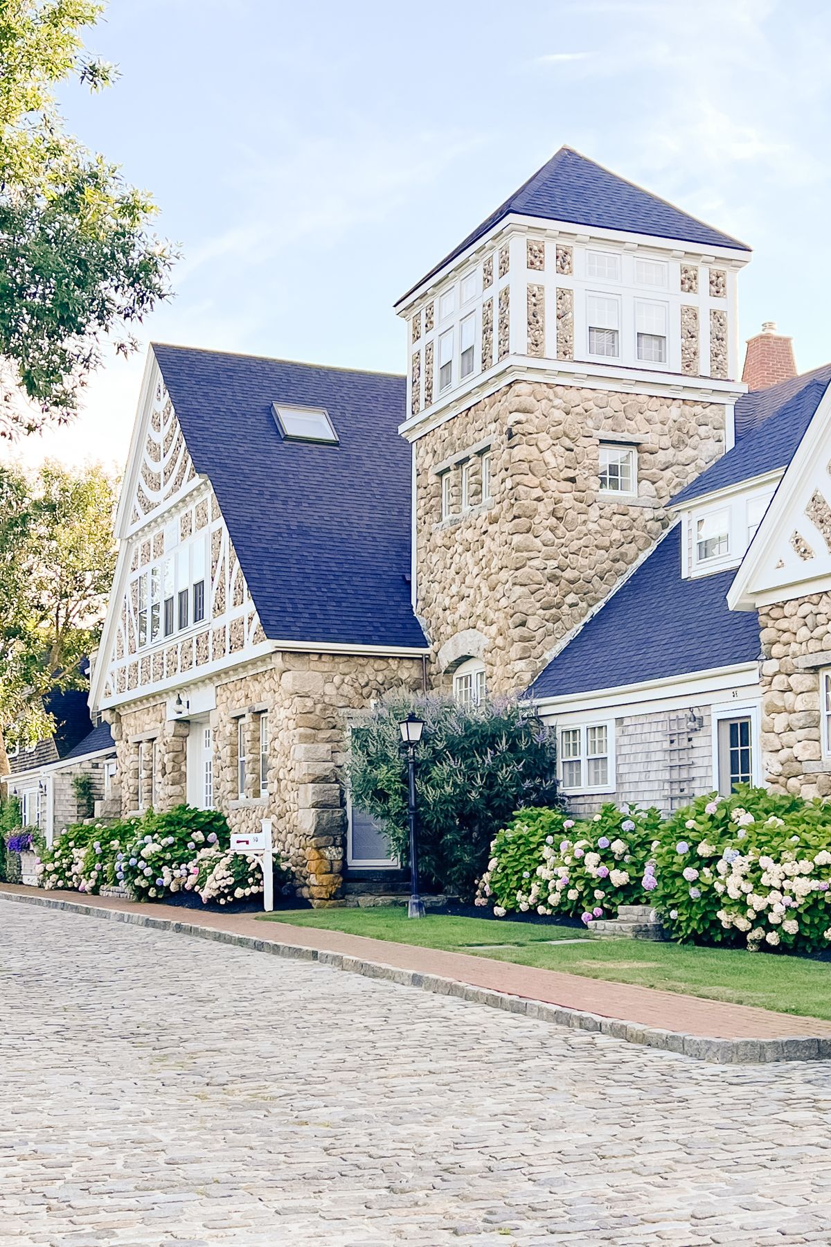 A stone home with hydrangeas on Nantucket