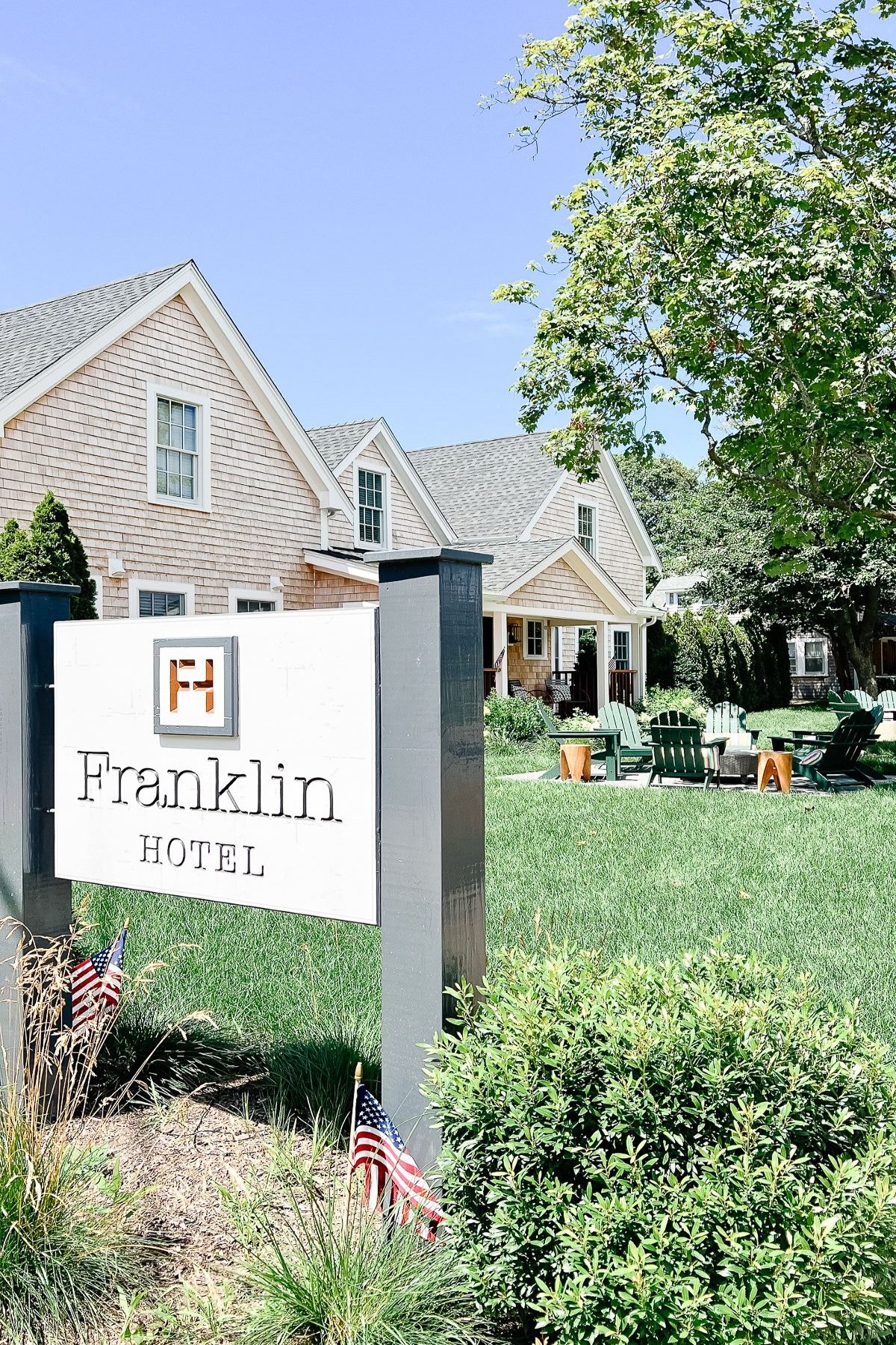 A sign that reads "Franklin Hotel" with a shingled Martha's Vineyard building in the background