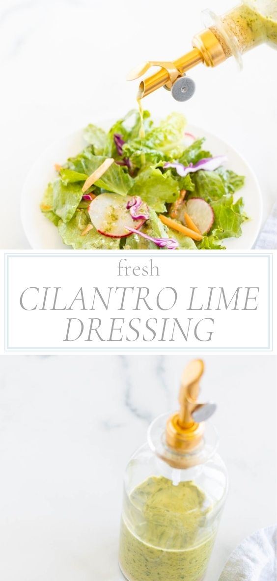 In a glass bottle there is cilantro lime dressing and it is being poured over a salad.