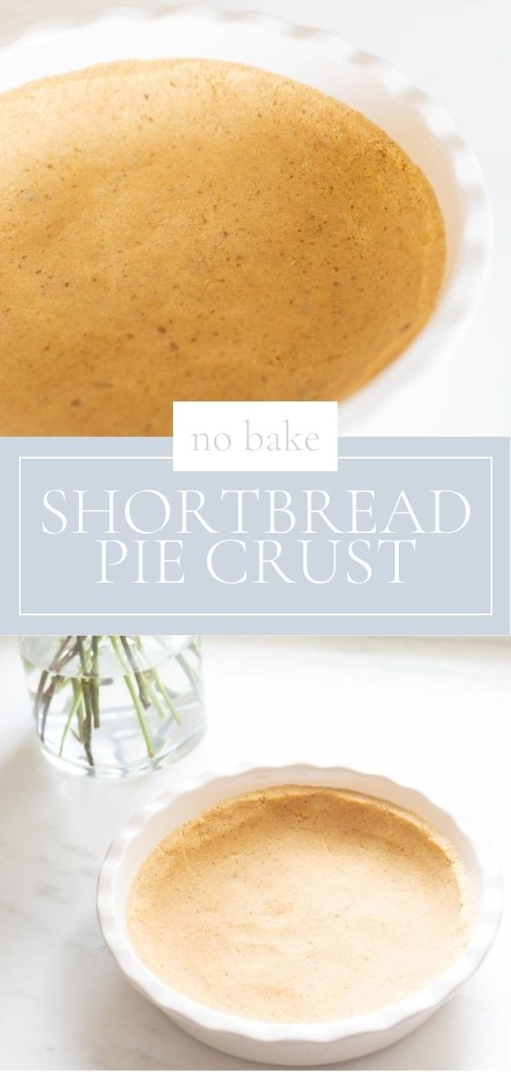 A shortbread crust pressed into a white ruffled ceramic pie dish on a marble surface, flowers to the side