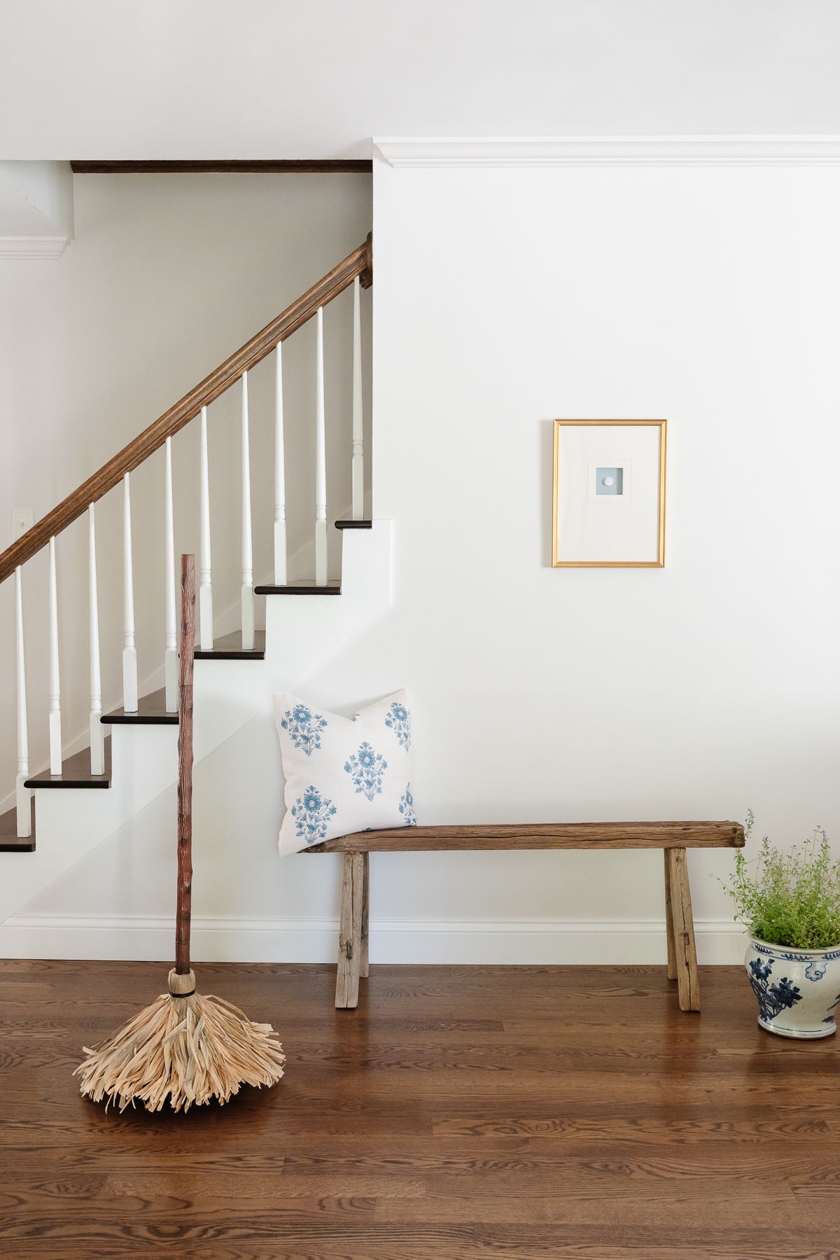 An entryway of a home with wood floors and white walls, decorated with Amazon Halloween decor