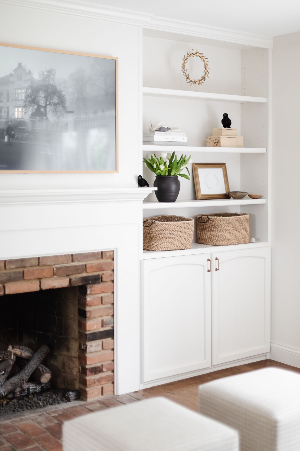 White bookshelves with touches of black crows for Halloween