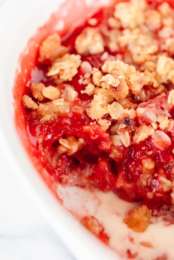 A strawberry crumble, topping with a crumble topping with oats.