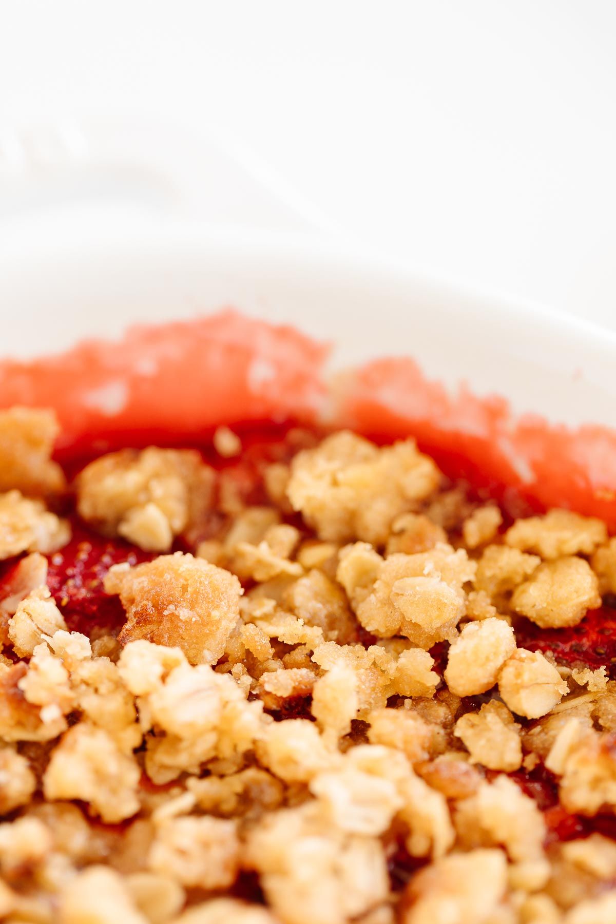 A strawberry crumble, topping with a crumble topping with oats.