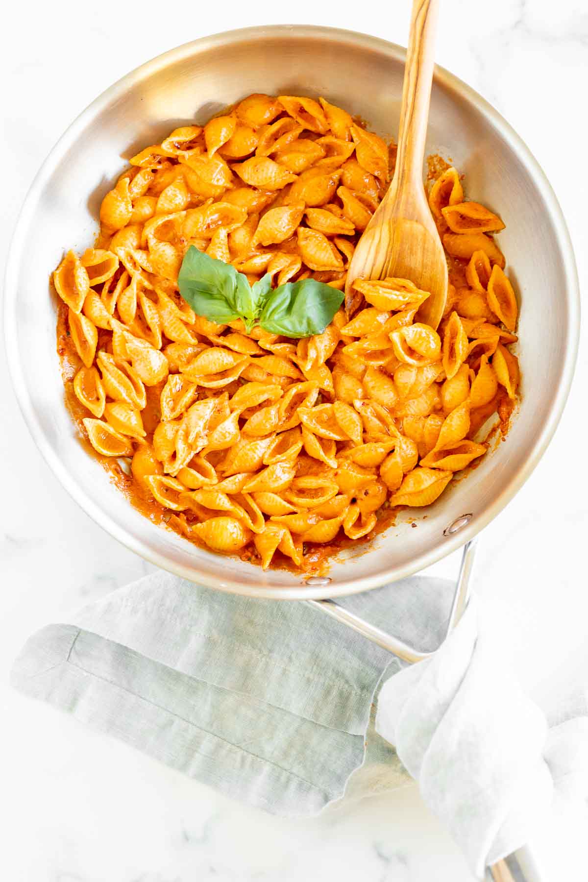 A silver pan full of Gigi Hadid pasta, a spicy vodka shell pasta recipe.