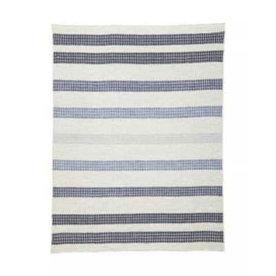 a blue and white striped rug on a white background